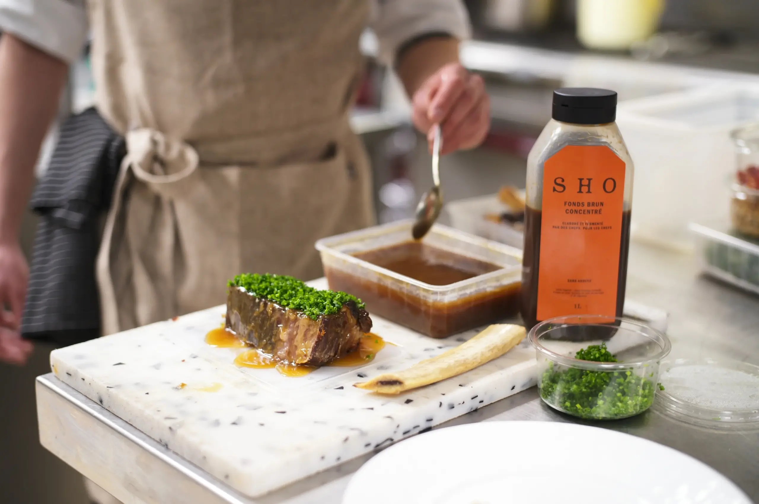 Rich beef sausage meat reduction prepared with roasted vegetables, beef tallow, and EATTT Concentrated Dark Stock.