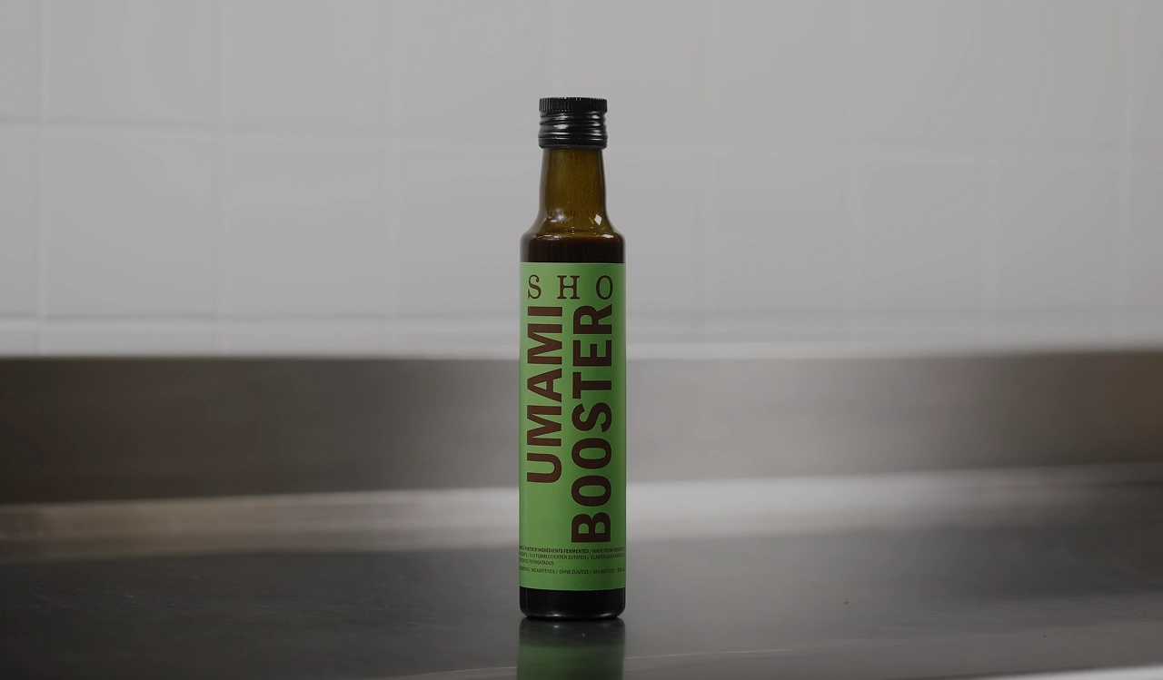 SHO Umami Booster bottle labeled as seasoning with technical file and ingredient information
