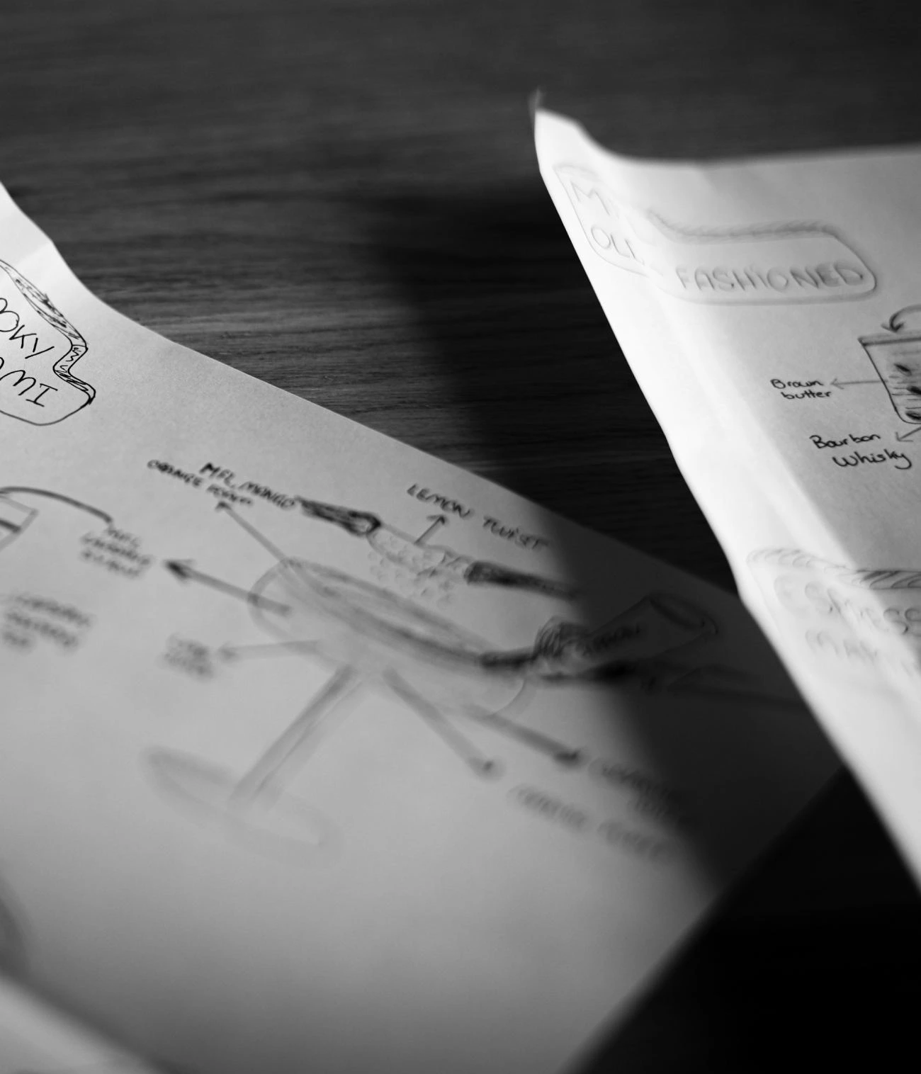 Black and white close-up of handwritten recipe development notes for chef recipe transformation and food brand taste intelligence