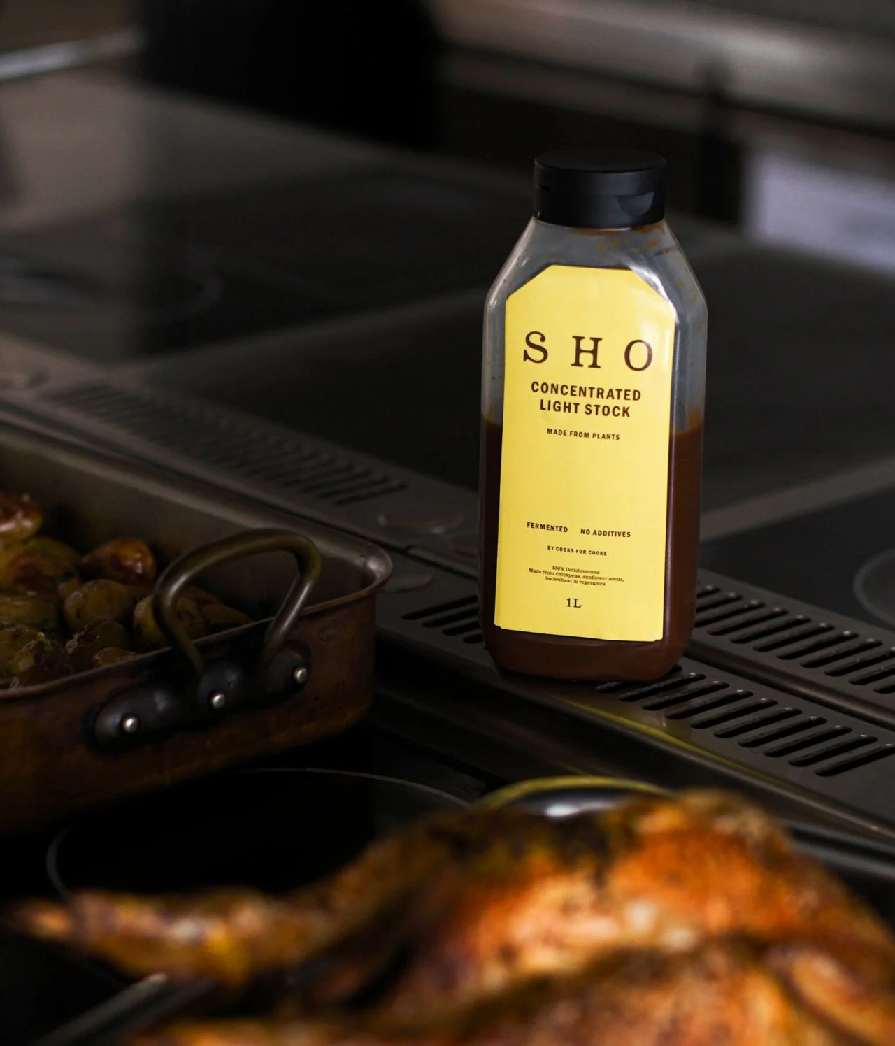 SHO Concentrated Light Stock bottle on a stovetop, illustrating how to use EATTT stock concentrates