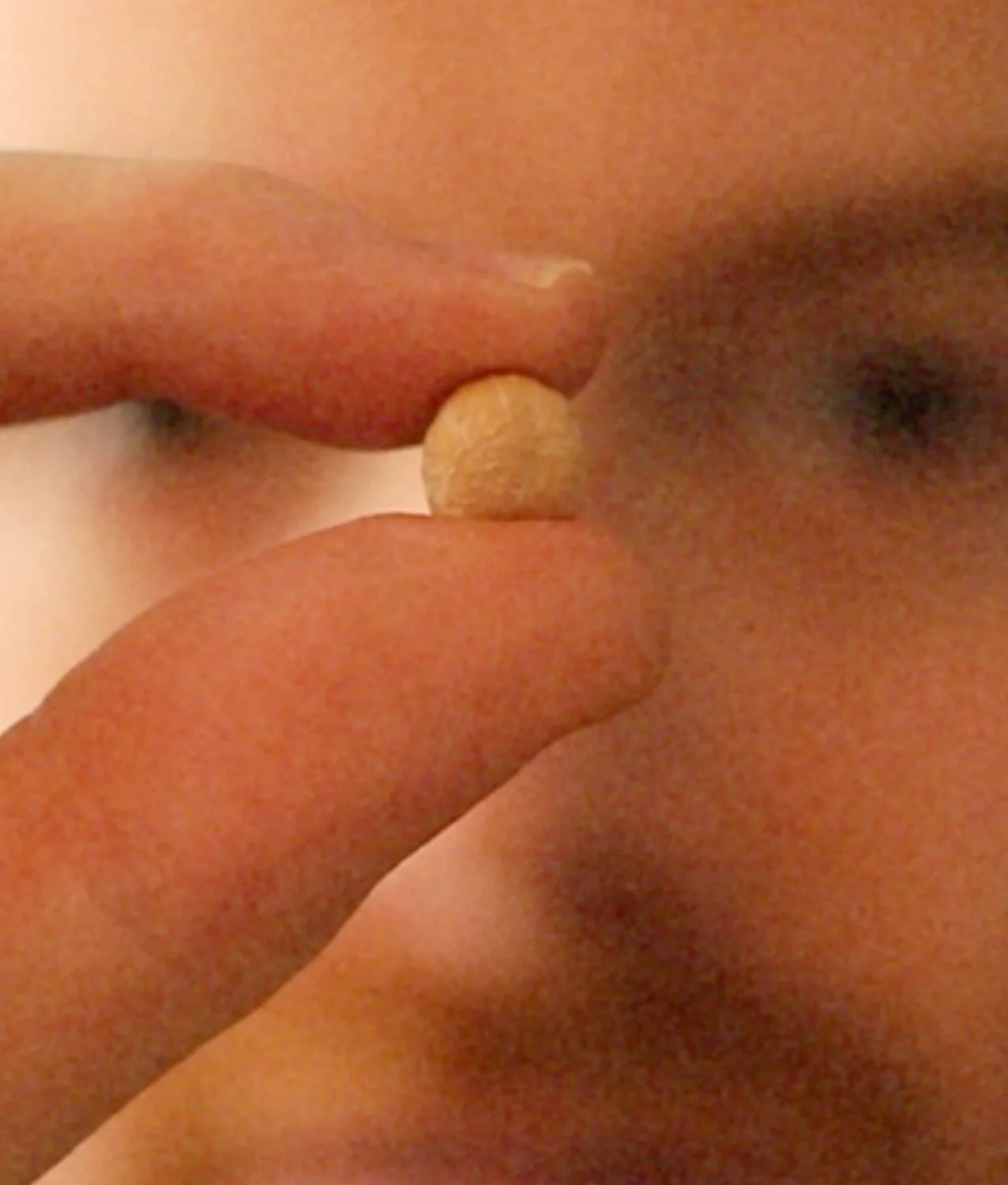 Close-up of a person tasting a fermented grain, illustrating EATTT's new generation of culinary bases